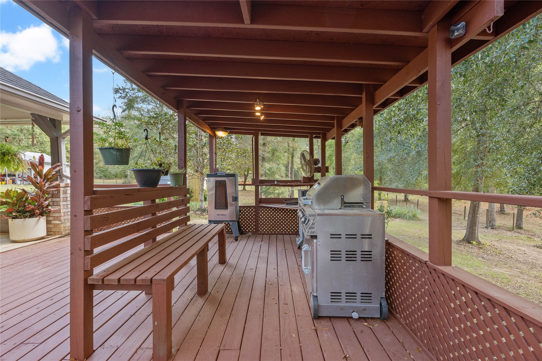 600 Hughes Loop Willis, TX 77378 - Photo 33 of 50 a view of a patio with wooden floor