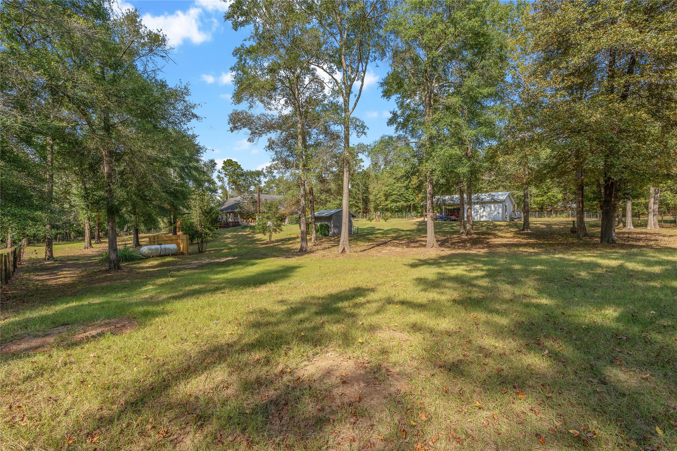 600 Hughes Loop Willis, TX 77378 - Photo 39 of 50 a backyard of a building with trees