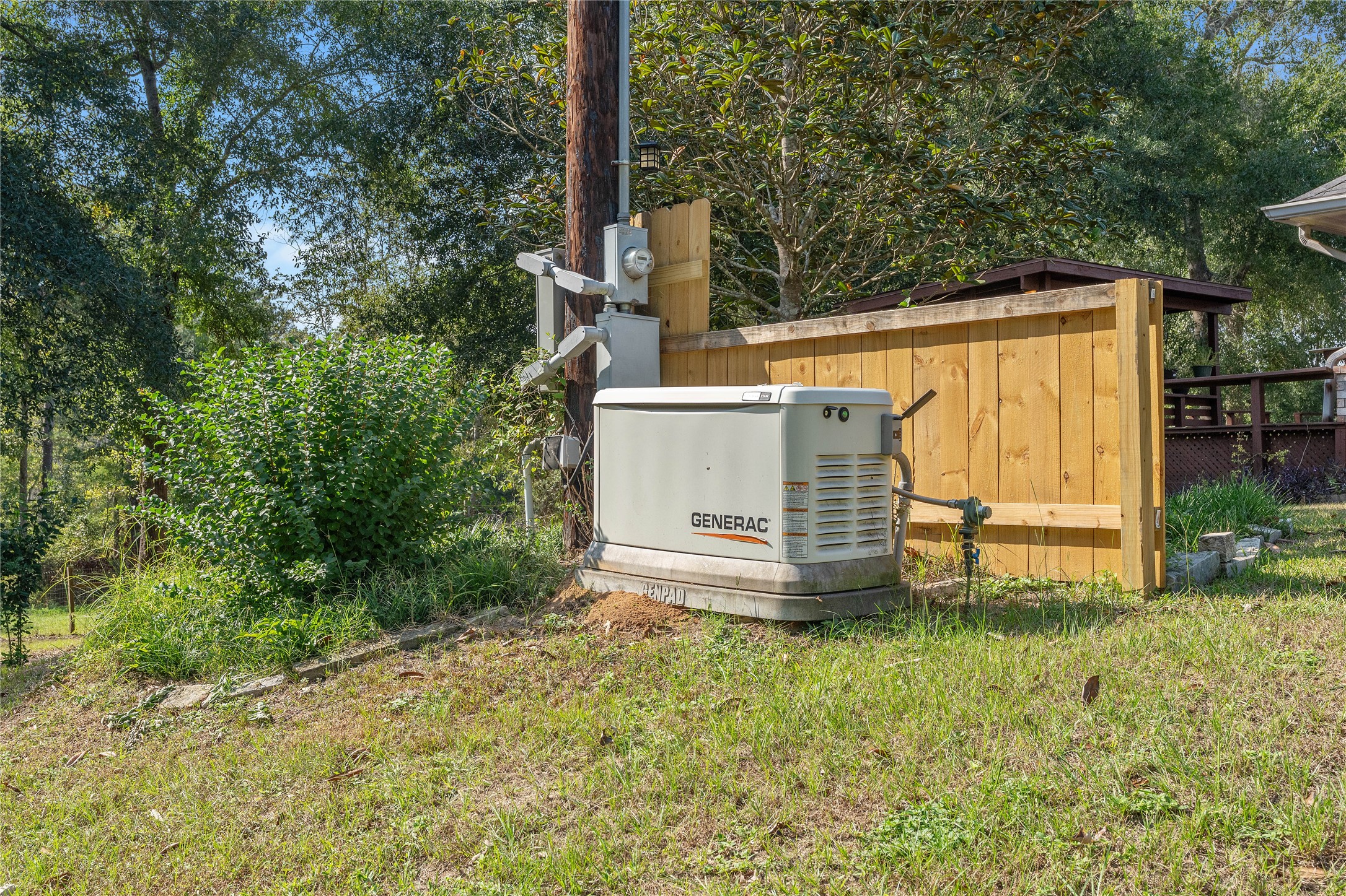 600 Hughes Loop Willis, TX 77378 - Photo 43 of 50 a view of a house with backyard and a tree