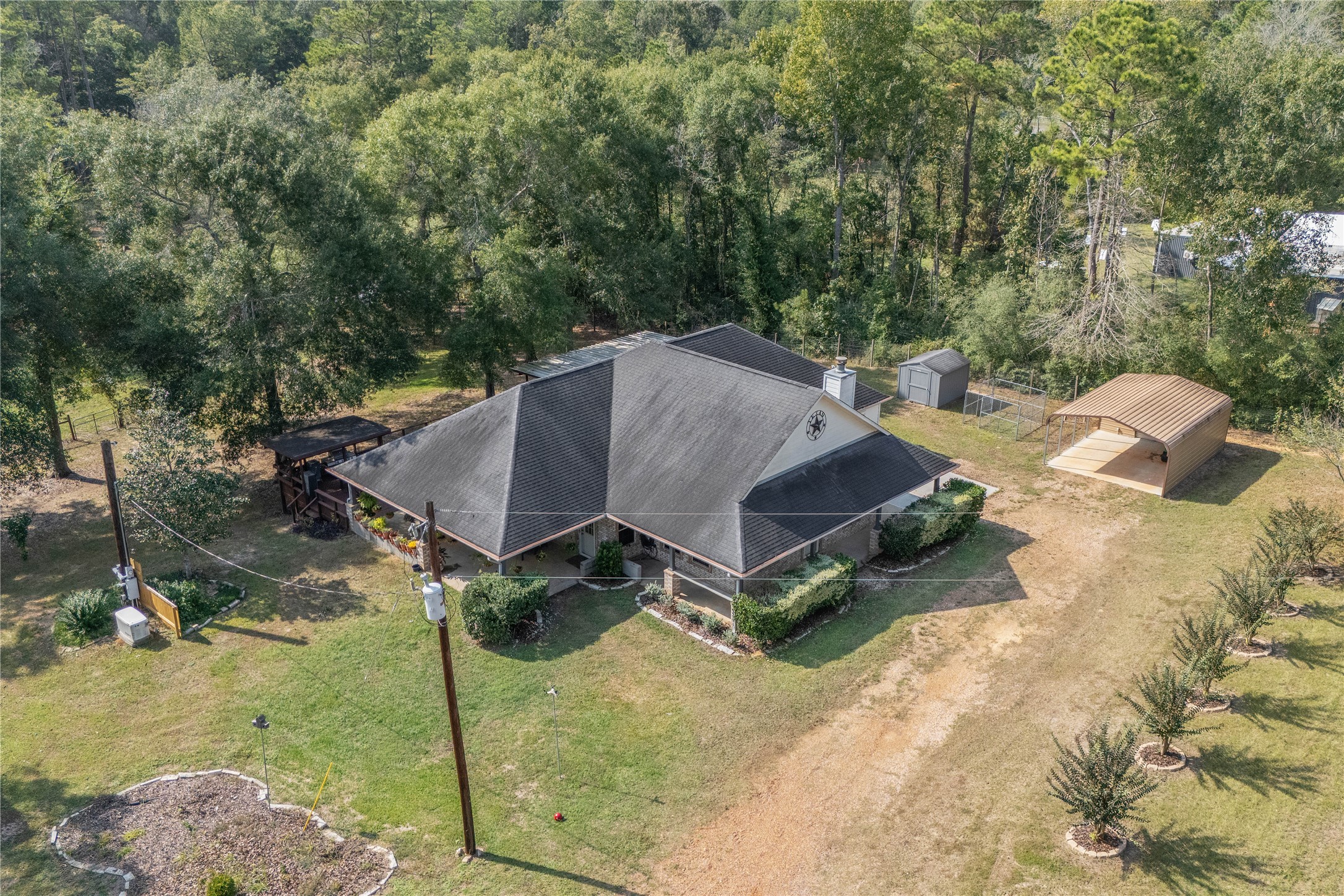600 Hughes Loop Willis, TX 77378 - Photo 45 of 50 a aerial view of a house with yard and patio