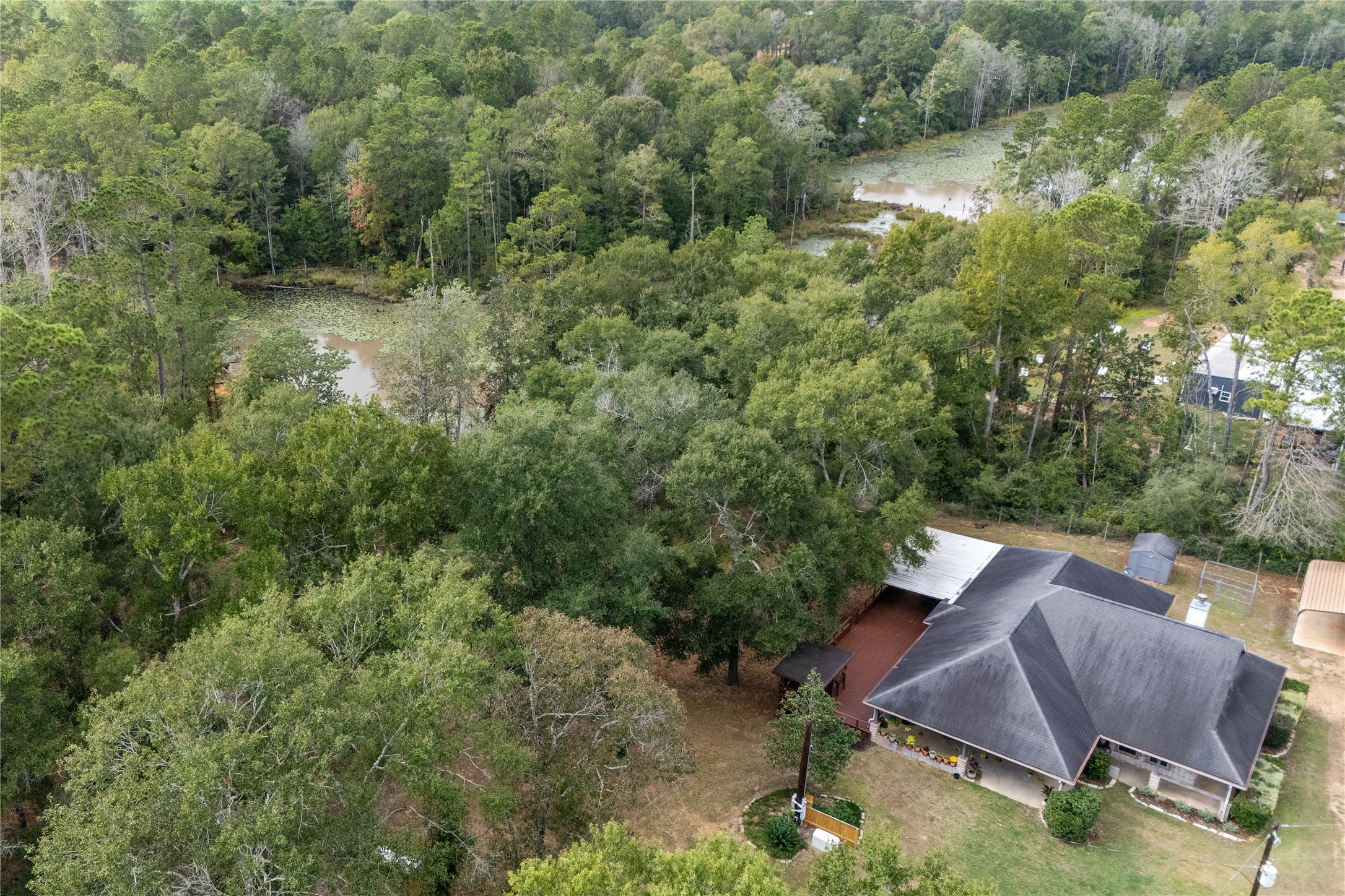 600 Hughes Loop Willis, TX 77378 - Photo 47 of 50 a view of a house with a yard