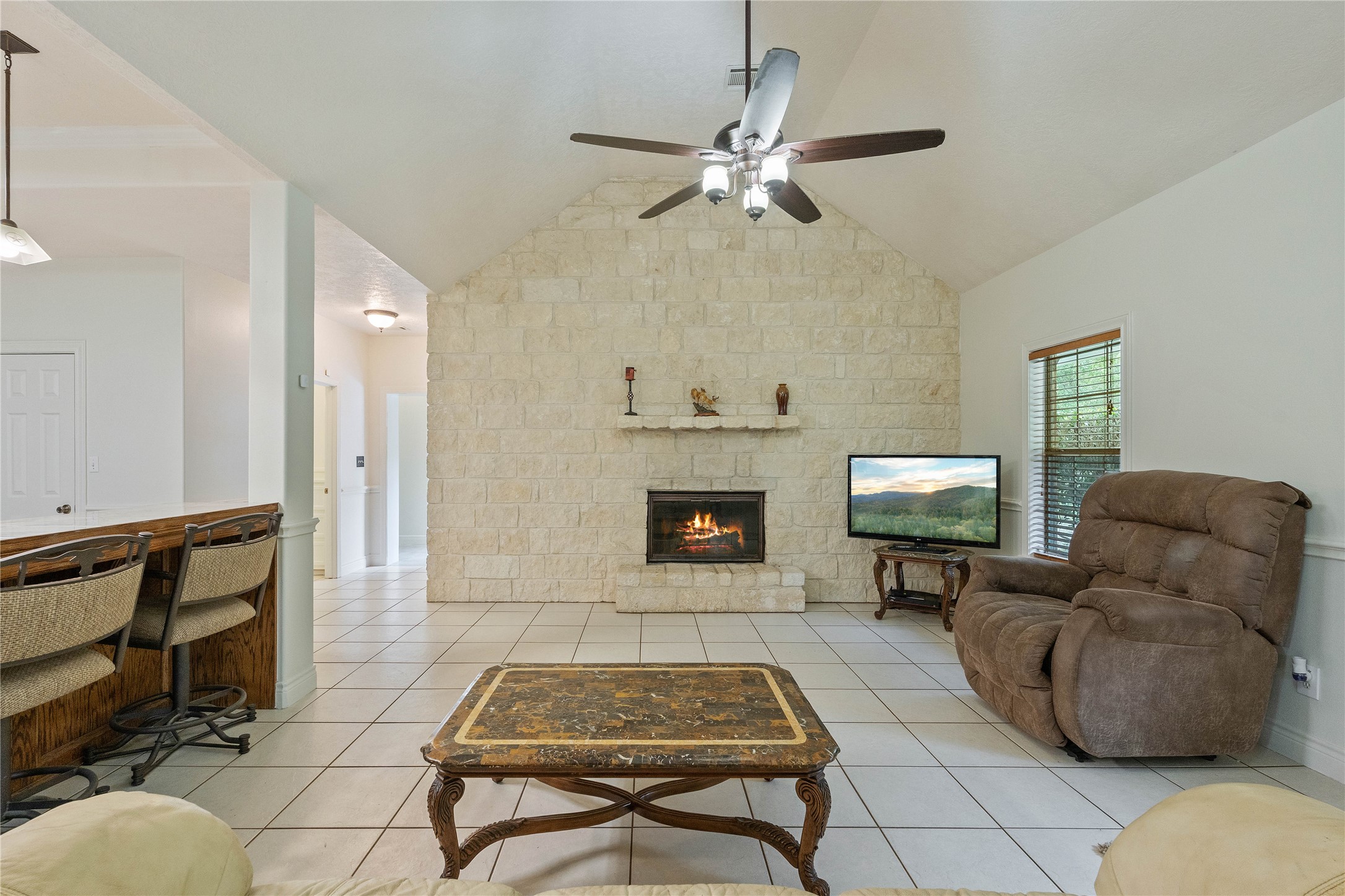 600 Hughes Loop Willis, TX 77378 - Photo 7 of 50 a living room with furniture and a fireplace