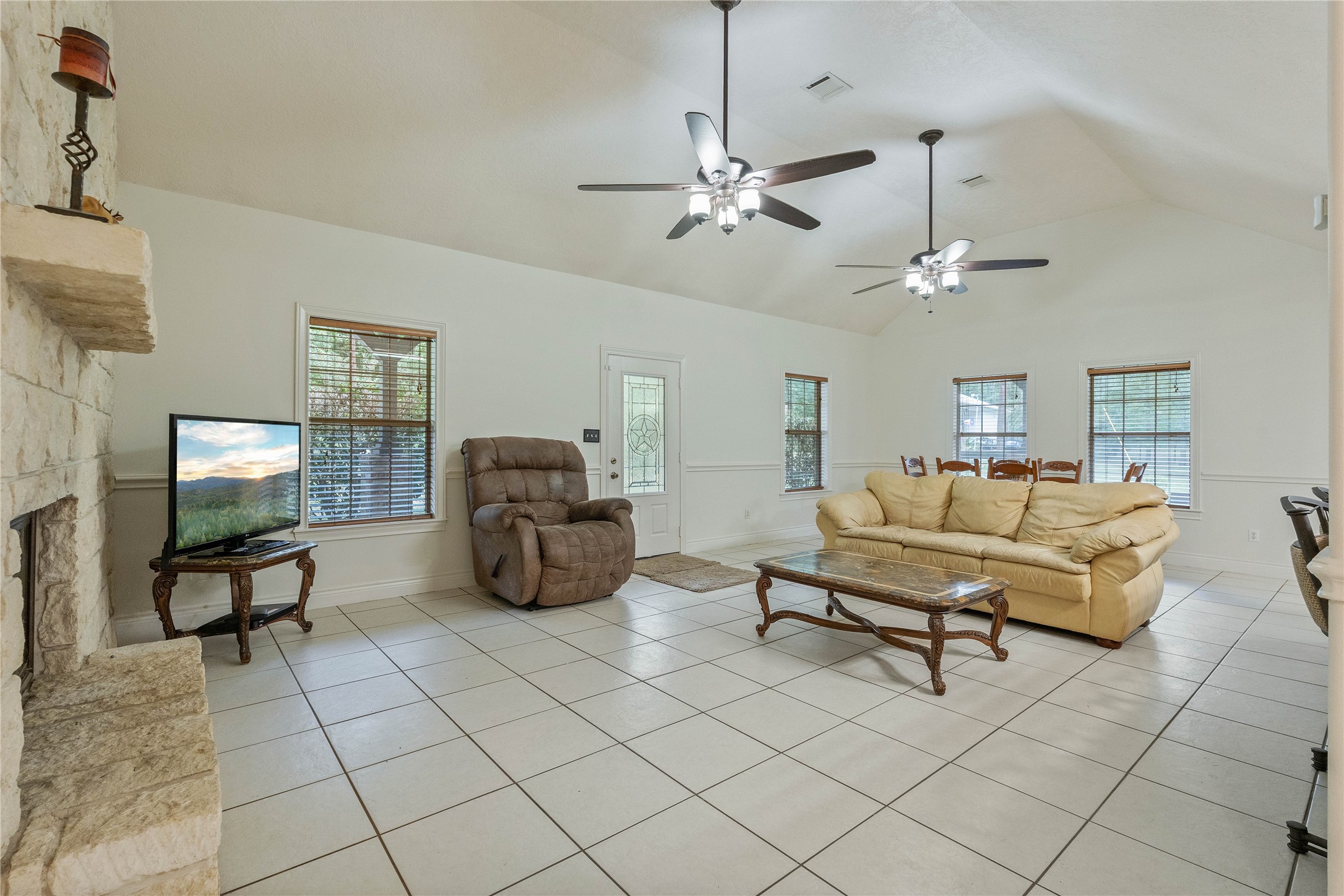 600 Hughes Loop Willis, TX 77378 - Photo 9 of 50 a living room with furniture and a chandelier