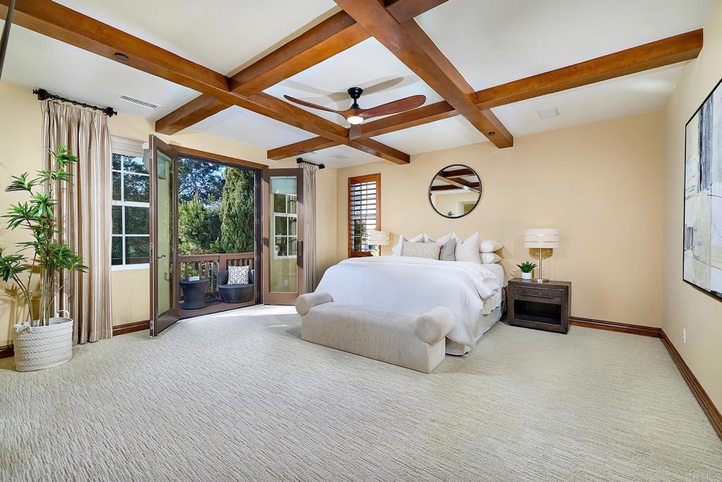 6591 Halite Place Carlsbad, CA 92009 - Photo 19 of 33 a bedroom with a large bed and a large window