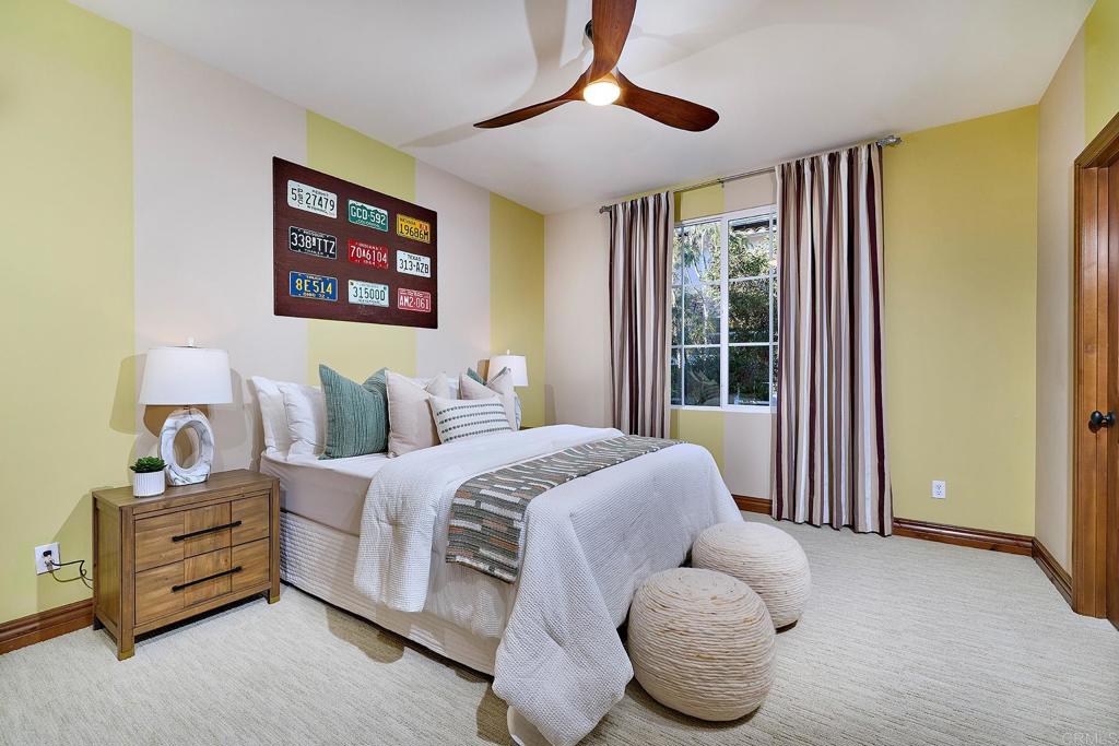 6591 Halite Place Carlsbad, CA 92009 - Photo 23 of 33 a bedroom with bed and a large window