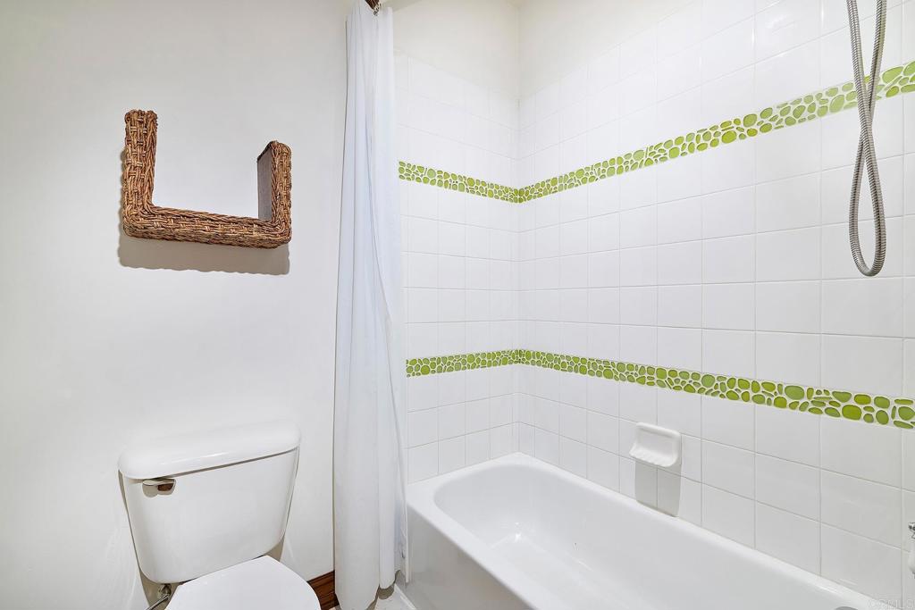6591 Halite Place Carlsbad, CA 92009 - Photo 25 of 33 a bathroom with a bathtub and a shower