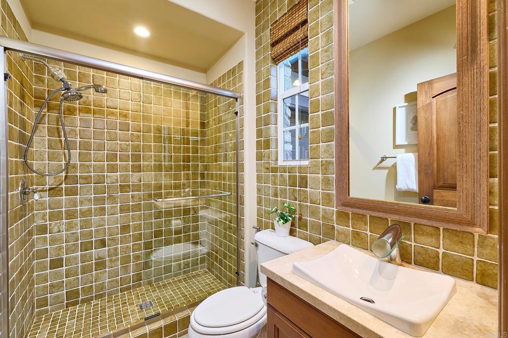 6591 Halite Place Carlsbad, CA 92009 - Photo 6 of 33 a bathroom with a sink toilet and shower