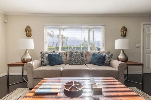 a living room with a couch and a lamp