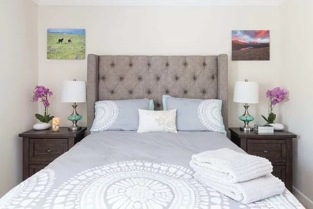 a bedroom with a bed and a table