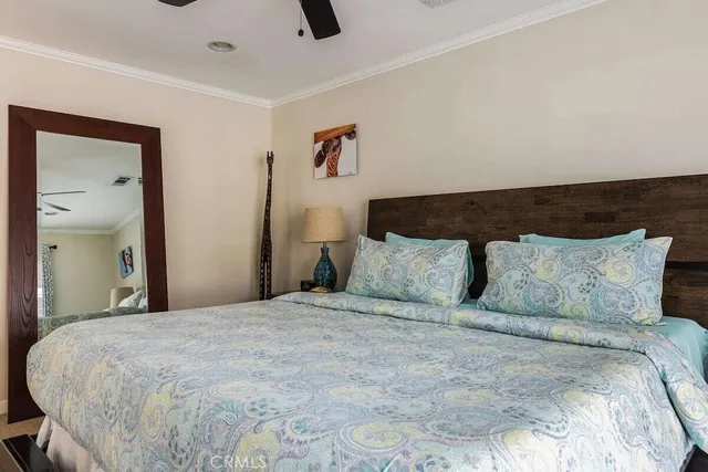 a large bed in a white room