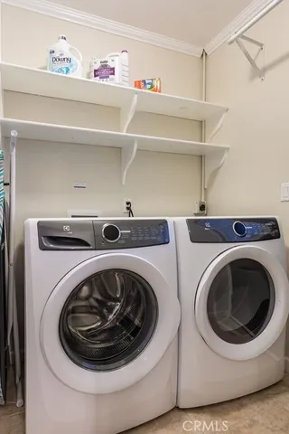 a utility room with washing machine