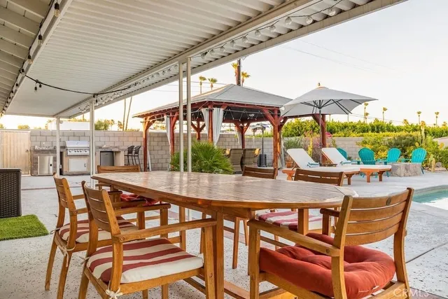 an outdoor view of the patio and swimming pool
