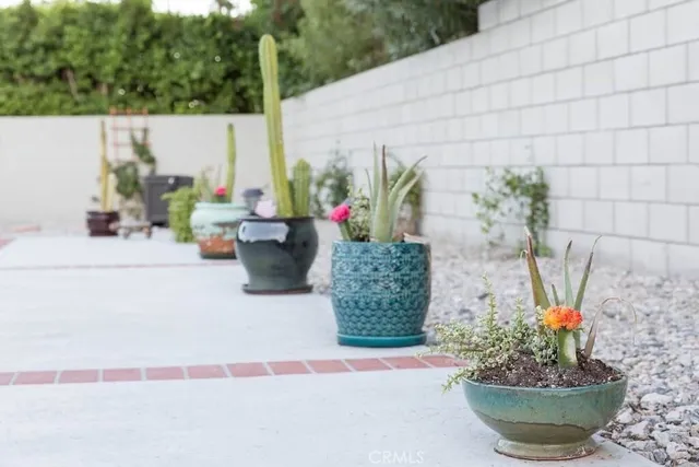 a view of a backyard with sitting area