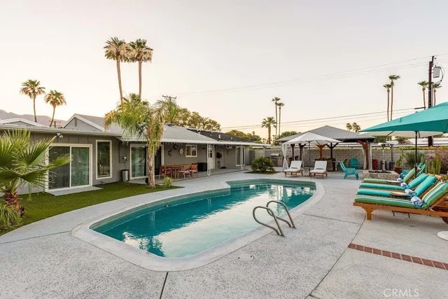 a view of a house with swimming pool