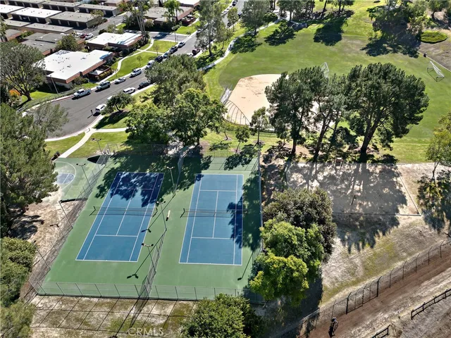 an aerial view of a house with a yard and lake view
