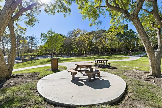 a view of yard with swimming pool and trees