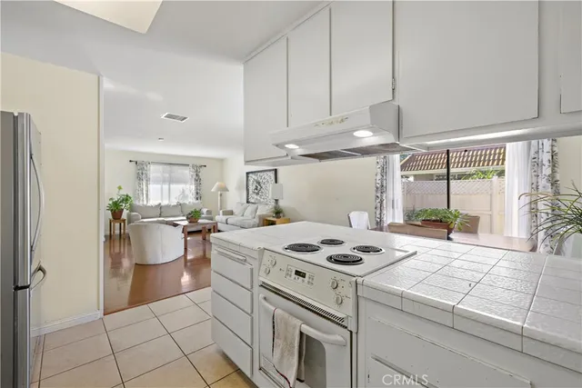 a kitchen with a dining table and chairs