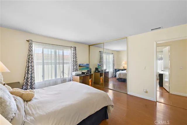 a bedroom with a bed and a chair