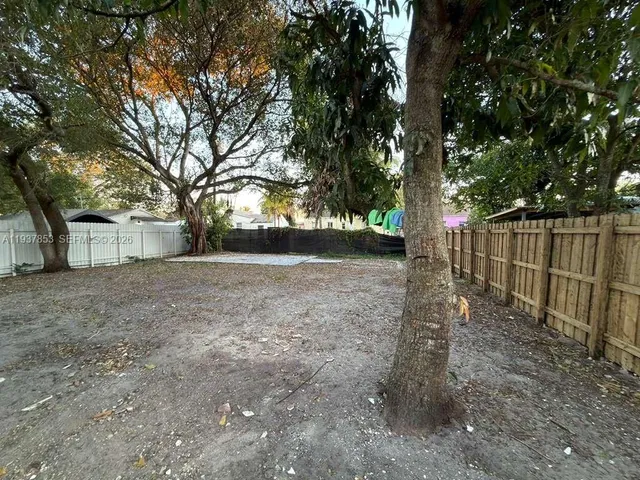 a view of backyard with green space