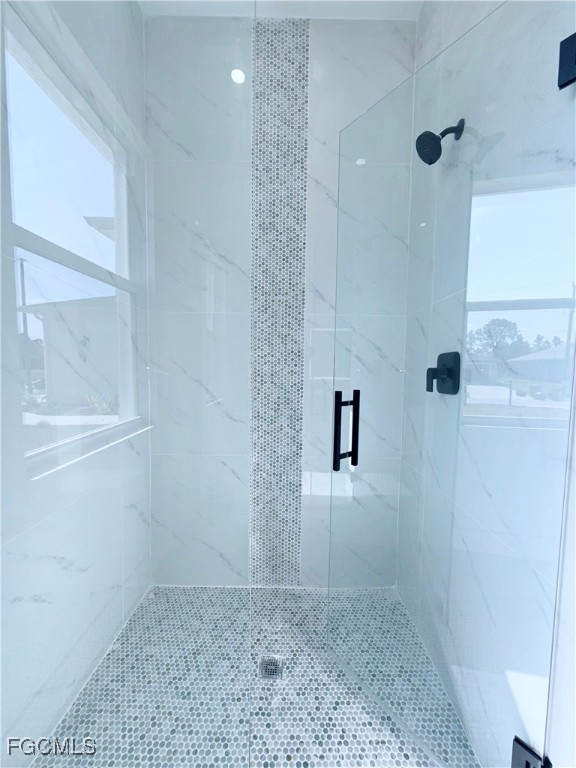 4006 2nd Street Southwest Lehigh Acres, FL 33976 - Photo 17 of 29 a bathroom with a shower