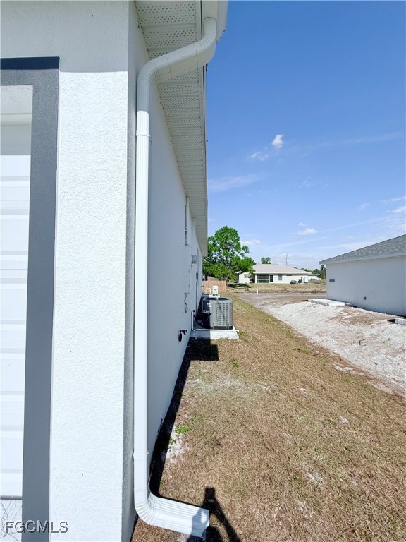 4006 2nd Street Southwest Lehigh Acres, FL 33976 - Photo 27 of 29 a view of a living room and staircase