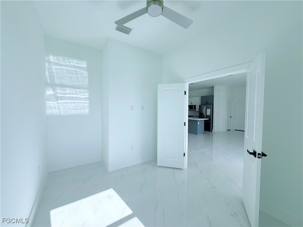 4006 2nd Street Southwest Lehigh Acres, FL 33976 - Photo 4 of 29 a view of livingroom and a bathroom with a sink