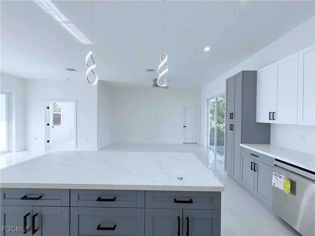 4006 2nd Street Southwest Lehigh Acres, FL 33976 - Photo 9 of 29 a room with a table and window