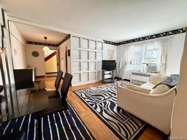 a living room with furniture fireplace and a flat screen tv