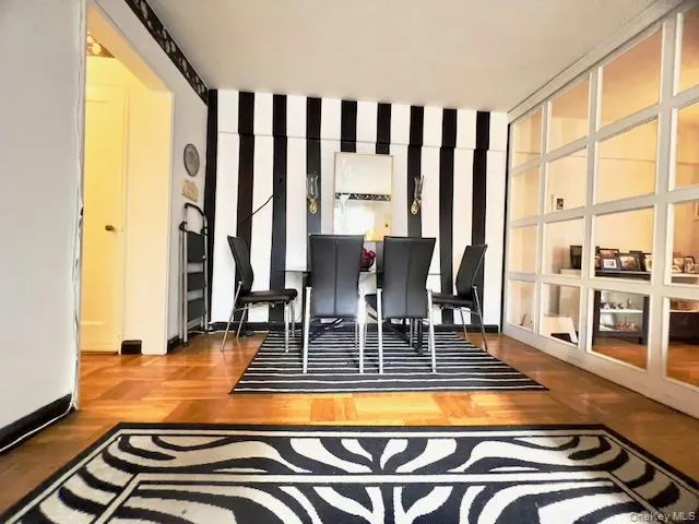 a view of a swimming pool with furniture