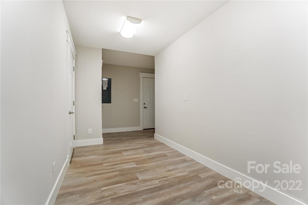 6250 Faith Road Salisbury, NC 28146 - Photo 29 of 38 a view of a hallway with wooden floor