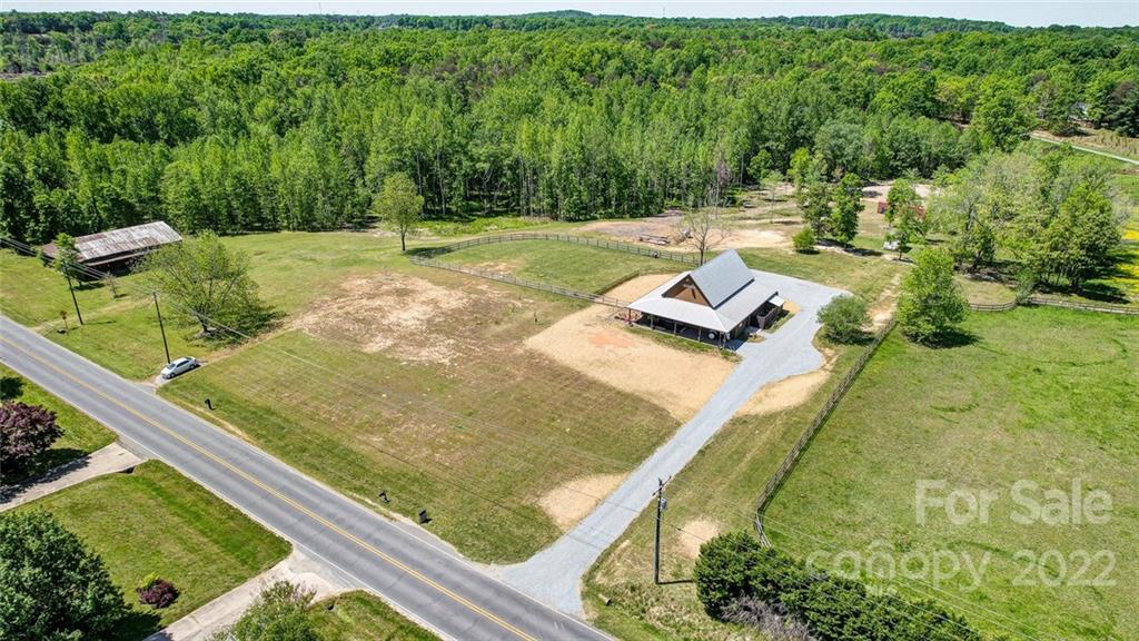 6250 Faith Road Salisbury, NC 28146 - Photo 38 of 38 a view of a yard with an outdoor seating