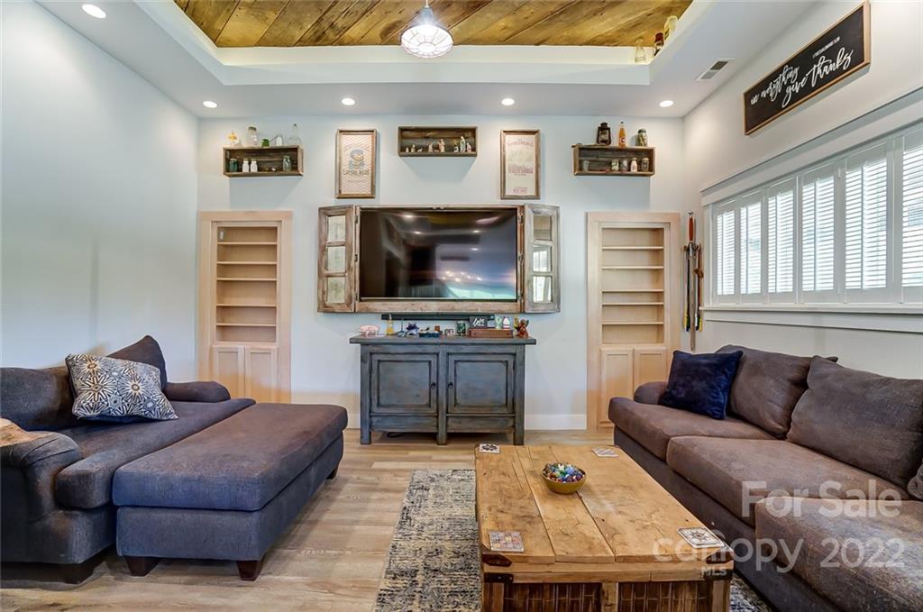 6250 Faith Road Salisbury, NC 28146 - Photo 5 of 38 a living room with furniture and a flat screen tv