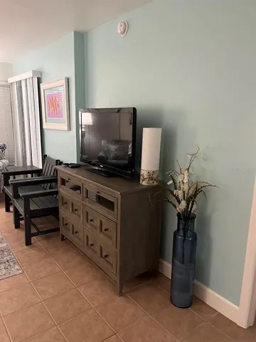 a bedroom with a bed and a mirror