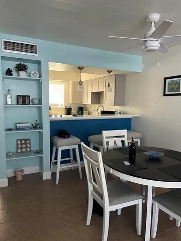 a kitchen with a sink cabinets and window