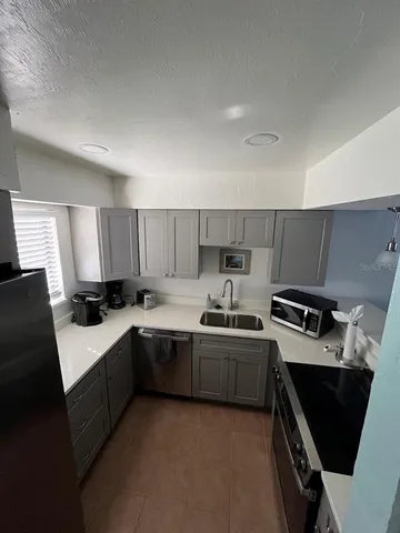 a entryway with a table and chairs in patio