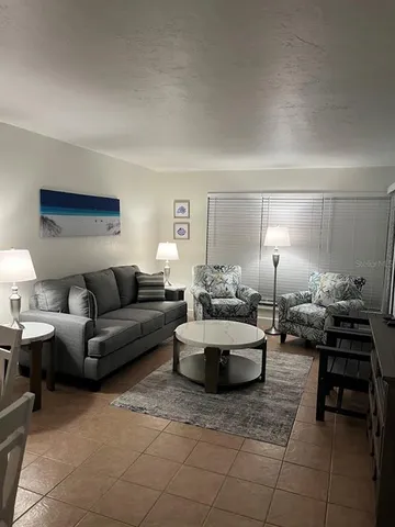 a bedroom with a bed and a night stand