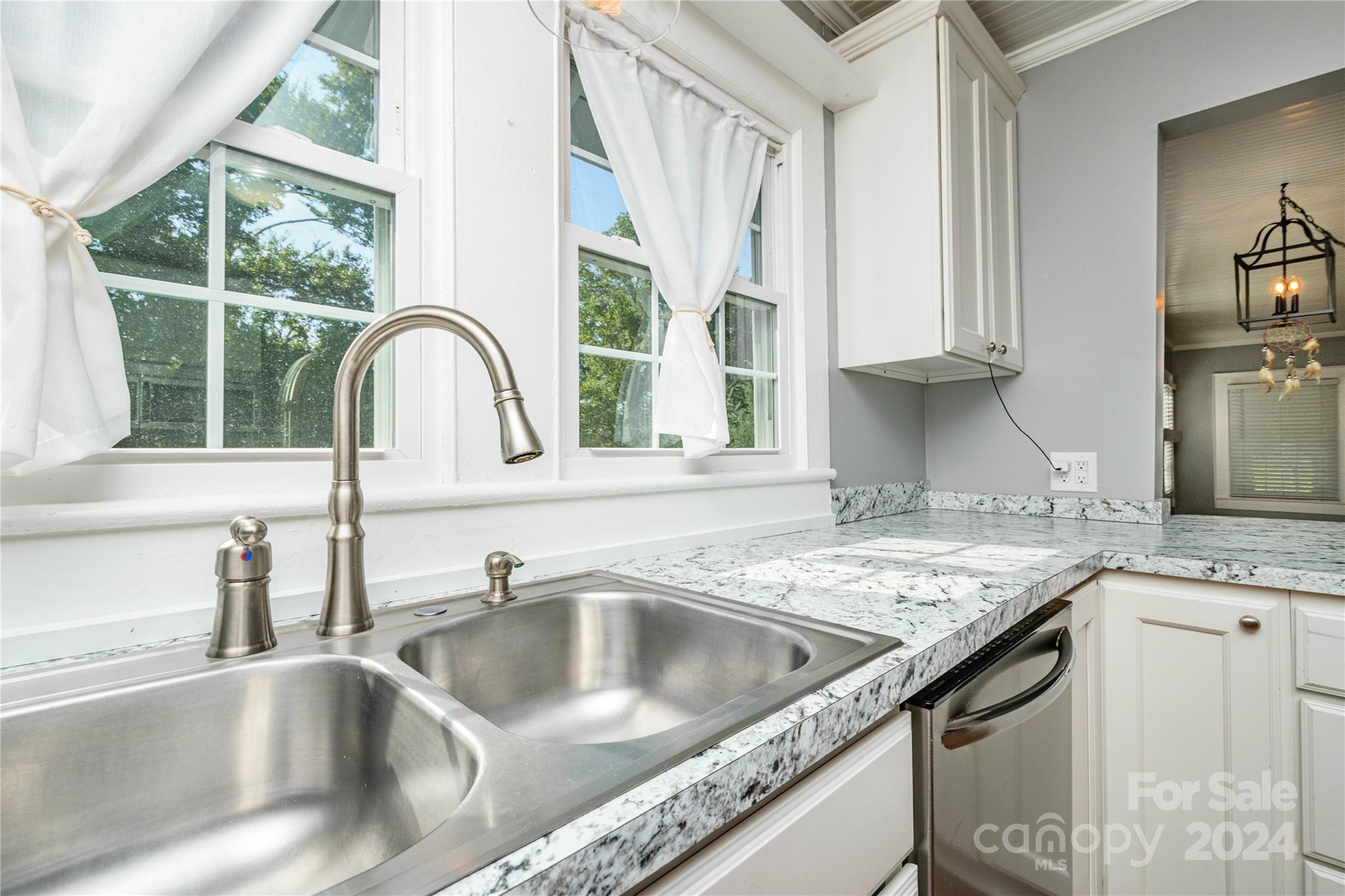 648 Chimney Rock Road Rutherfordton, NC 28139 - Photo 13 of 43 a kitchen with granite countertop a sink and a counter top space