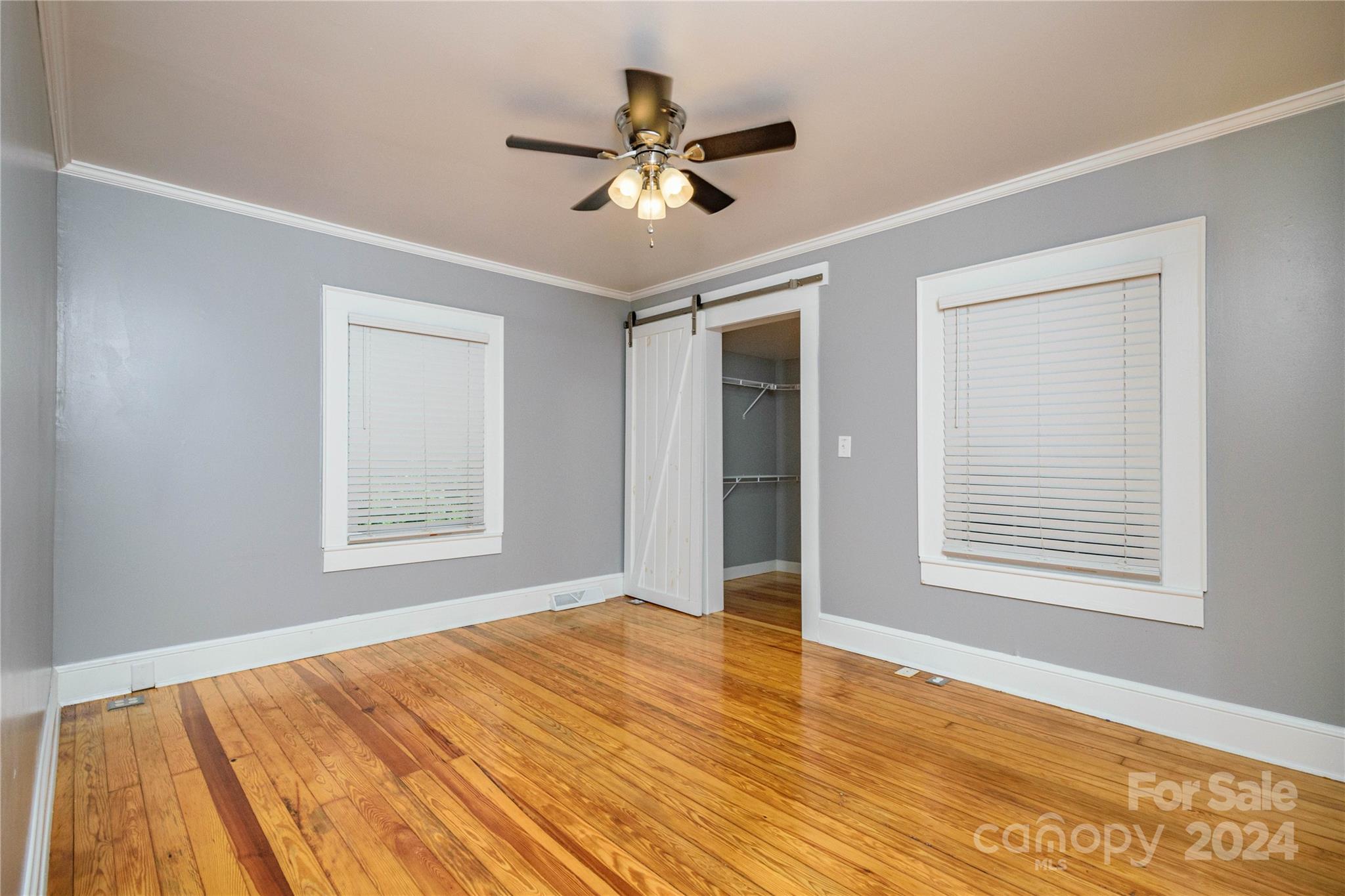 648 Chimney Rock Road Rutherfordton, NC 28139 - Photo 14 of 43 a view of an empty room with wooden floor and a window
