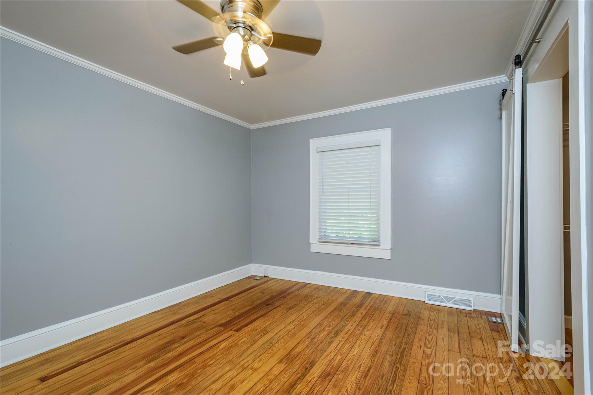 648 Chimney Rock Road Rutherfordton, NC 28139 - Photo 17 of 43 wooden floor in an empty room with a window