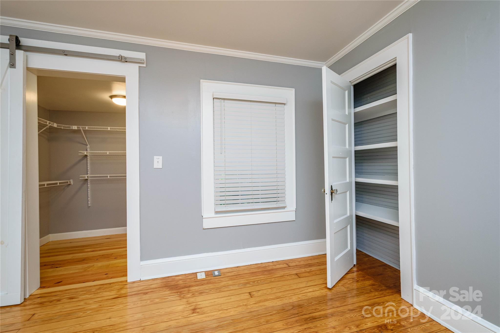 648 Chimney Rock Road Rutherfordton, NC 28139 - Photo 19 of 43 a view of an empty room with wooden floor and a window