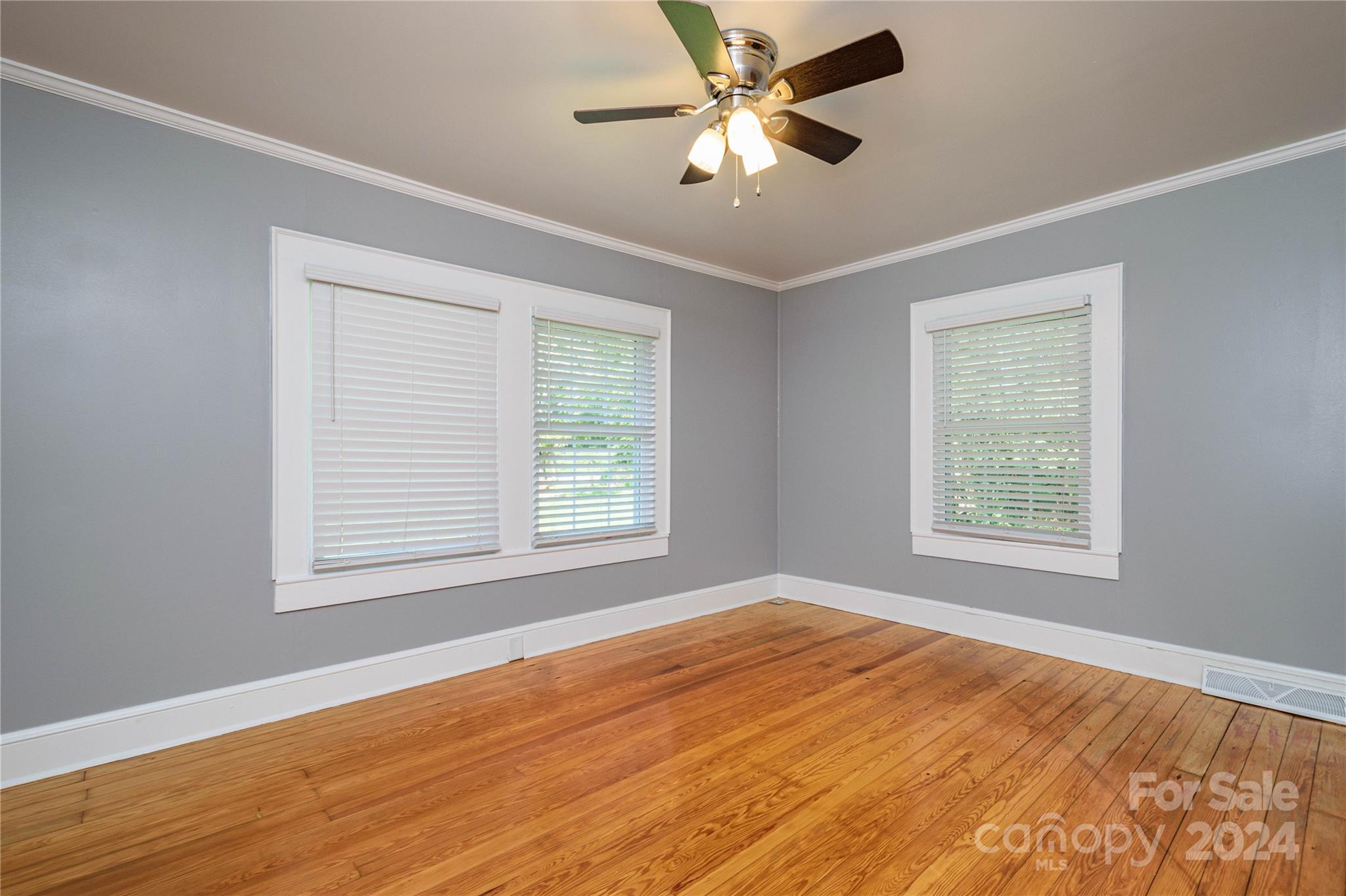 648 Chimney Rock Road Rutherfordton, NC 28139 - Photo 25 of 43 a view of an empty room with wooden floor and a window