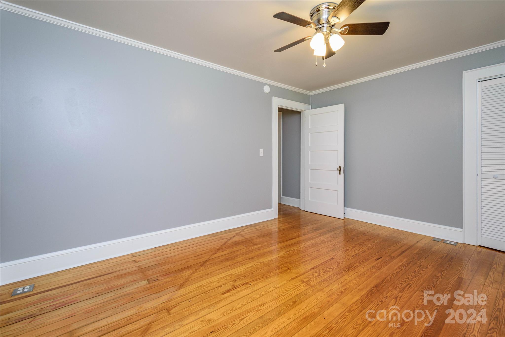 648 Chimney Rock Road Rutherfordton, NC 28139 - Photo 27 of 43 a view of an empty room with window and wooden floor