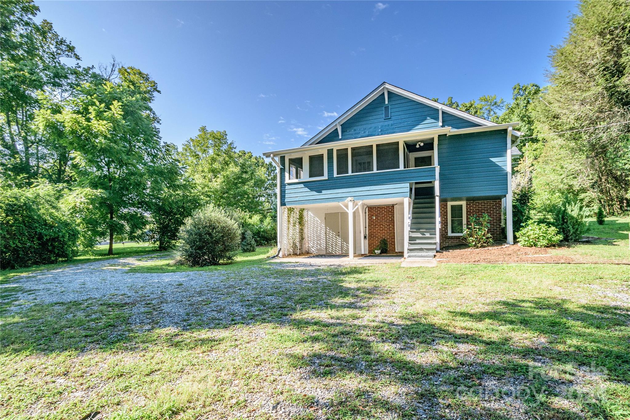 648 Chimney Rock Road Rutherfordton, NC 28139 - Photo 40 of 43 a front view of a house with a garden
