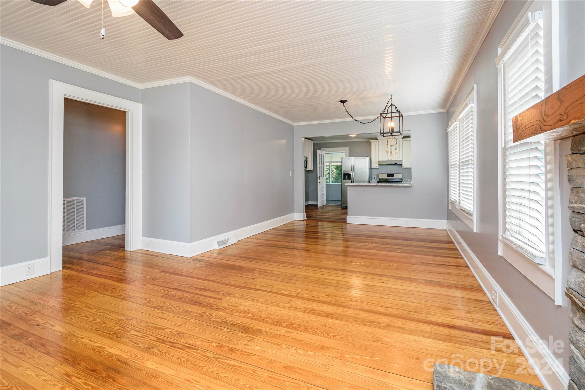 648 Chimney Rock Road Rutherfordton, NC 28139 - Photo 6 of 43 a view of an empty room with window and wooden floor