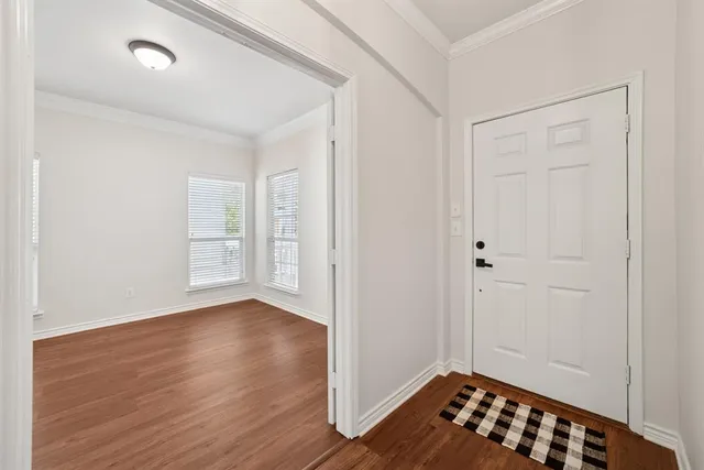 a view of livingroom with hardwood floor and hallway