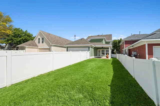 a view of a white house with a outdoor space
