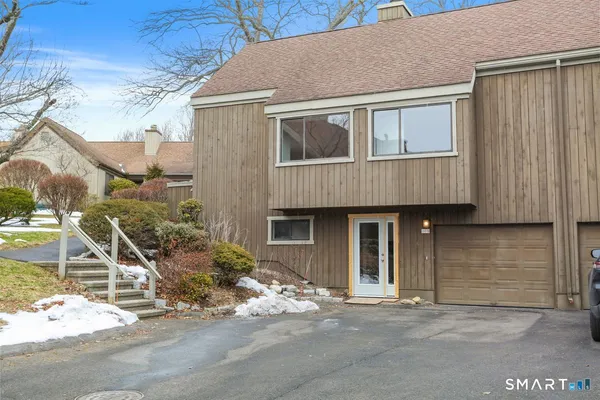 a front view of a house with garage