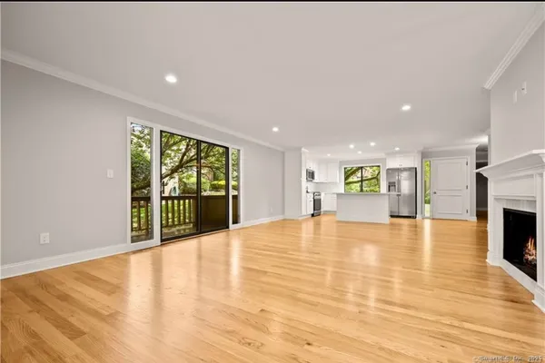 a view of an empty room with a fireplace