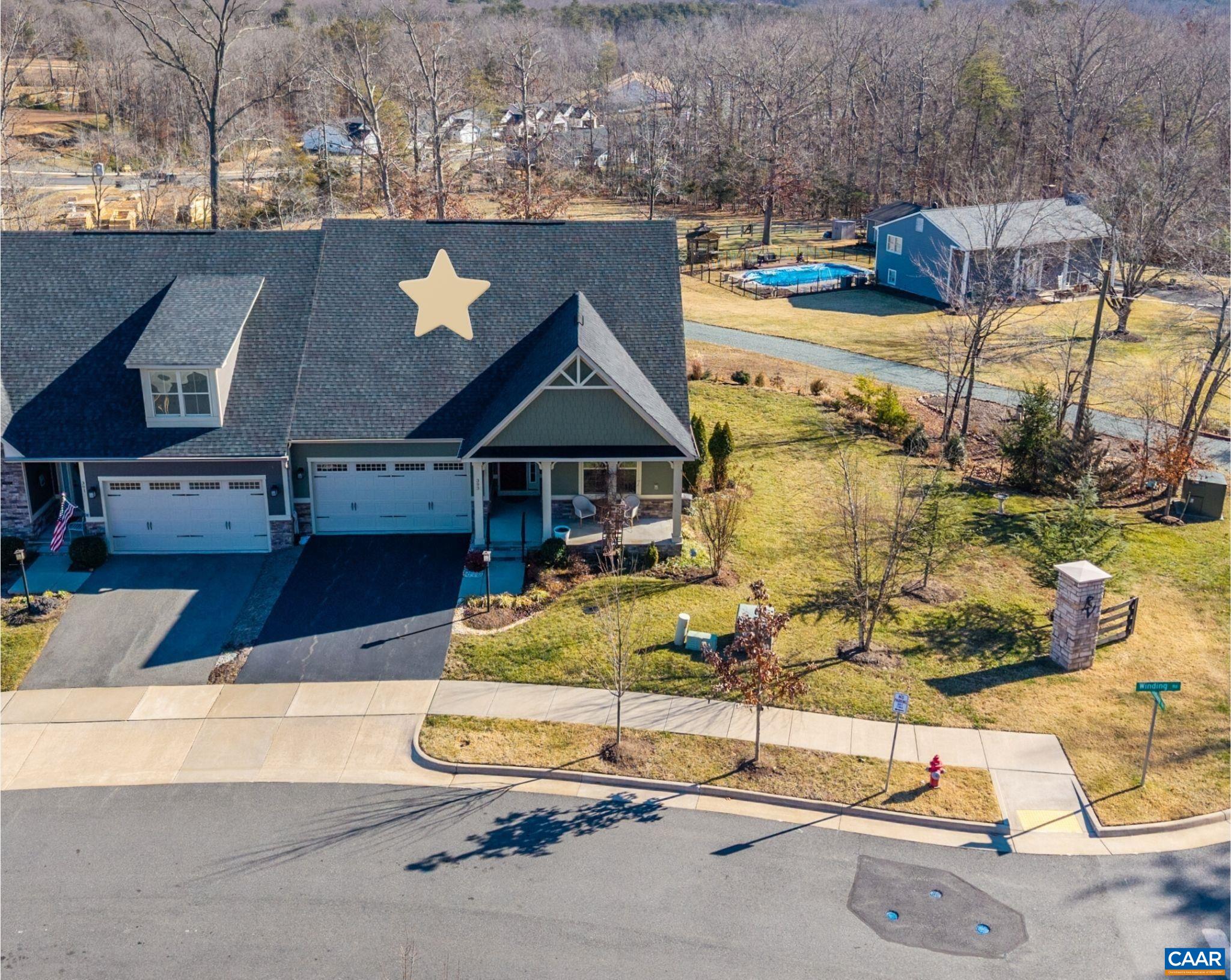 a aerial view of a house with swimming pool