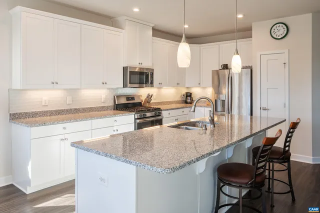 a view of a yard with wooden fence